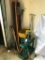 Group of Yard Tools and Holder In Front Corner of Garage