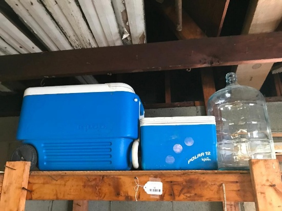 Two Coolers and a Glass Water Jug