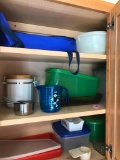 Cabinet of Plastic Ware and A Pyrex Item in Carrier
