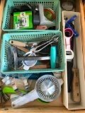 Two Middle Drawers of Dish Towels and Utensils in Two Drawers Next to Refrigerator