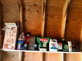 Top Shelf of Oil, Spreader and More in Shed!