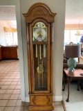 Howard Miller Grandfathers Clock In Oak Case W/Brass Pendelum & weights