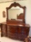 Ornate Dresser W/Beveled Mirror, Embossed Trim Work, & Burl Accents