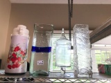 Hot and Cold Pump Dispenser, Decorative Clear Vase, and a Covered Clear Glass Container with Lid