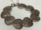 .925 Sterling Bracelet W/(9) Pierce Carved Hearts