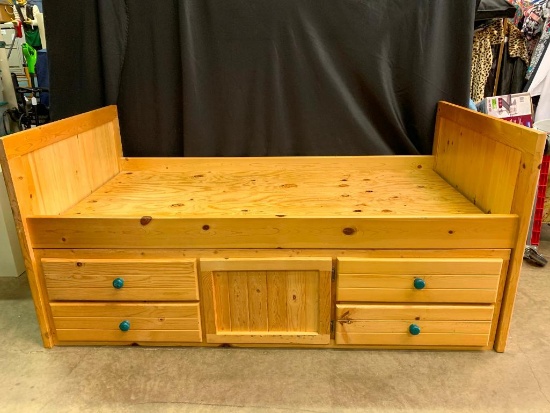 Single, Pine Bed with a Set of Drawers that Slide Under it