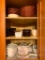 An Upper, Corner Kitchen Cabinet of Coring Ware, Vision Ware and Baskets