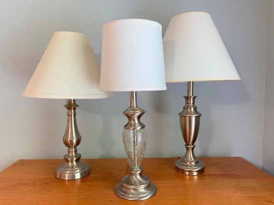 Group of Two Metal Lamps and A Metal and Glass Lamp