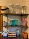 Group of Mason Jars, Drink Dispensers, Small Sewing Baskets and More on Laundry Room Shelves