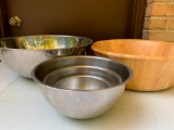 Group of Stainless Steel Mixing Bowls and a Wood Salad Bowl