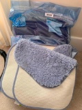 Group of Purple Towels and Two New Bath Rugs