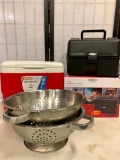 Two Colanders, One Cooler and Two Road Pro 12 Volt Portable Stoves, One stove is New!