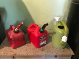 Two Plastic, 2 Gallon Gas Cans and a Watering Can as Pictured
