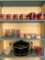 Shelf in Kitchen of Glass, Mugs and Crock Pot as Pictured