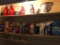 Group of Laundry Detergent, Household Cleaners and More Above Washer and Dryer