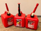 Three Two Gallon Gas Cans