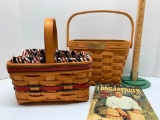 Pair of Longaberger Baskets with Book. The Largest Basket is 7