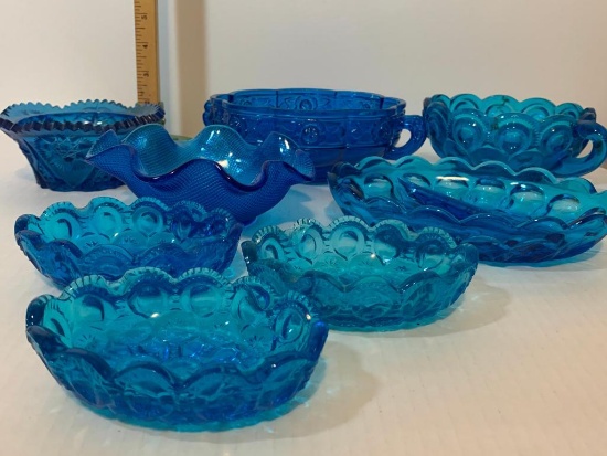 8 Piece lot of Colored Blue Glass Bowls. The Largest is 6.5" Diameter