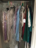 Group of Clothes in Master Bedroom Closet as Pictured