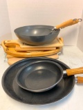 Group with Woks, Pans, and Cutting Boards