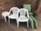 Two Plastic and Two Aluminum Outdoor Chairs with Three Plastic End Tables