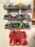 Contents of Peg Board Above Workbench and Plastic Bins Next to It