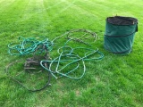 Group of Water Hose and Folding Yard Waste Basket