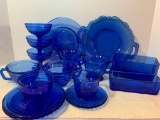 Large Lot of Blue Glass Sherbert Bowls, Mini Pitcher, Plates, and Bowls - As Pictured