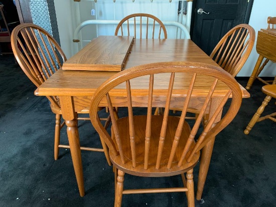 Table and Chair Set with 1 Leaf and 4 Chairs. This is 29" Tall x 48" Long x 36" Wide Without Leaf
