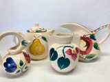 Set of 4 Various Size Pottery Pitchers.