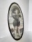 Antique Framed Photo of Child in Hat in Oval Metal Frame. This is 14