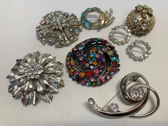 Set of 8 Fancy Brooches. The Largest is 2.5"