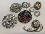 Set of 8 Fancy Brooches. The Largest is 2.5