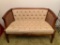 Cute Cane Sided Wood Loveseat Bench. Has Stain on the Seat. This is 30