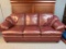 Burgundy Leather Overstuffed Sofa. Very Used. This is 36
