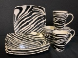 Set of 4 Zebra Print Plates and Coffee Mugs. The Plates are 10