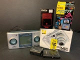 Tech Lot Incl Nixon Coolpix 5200, Sharper Image Clock/Radio/Sound Soother, Casio Portable 2.3