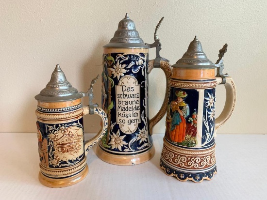3 German Beer Steins. One is a Music Box. The Tallest is 11" Tall