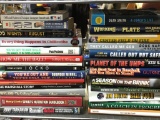 Two Stacks of Sports Titled Books
