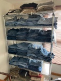 6 Shelves of Newer to Vintage Jeans and Pants. Most Appear to be Woman's 12-14 sizes.