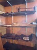 Three Shelves of Wooden Shelves and a Chalkboard