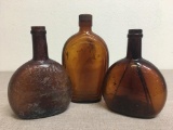 Group of Three Vintage Amber Bottles