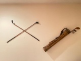 Antique Golf Clubs and Bag Hanging on Wall in Basement