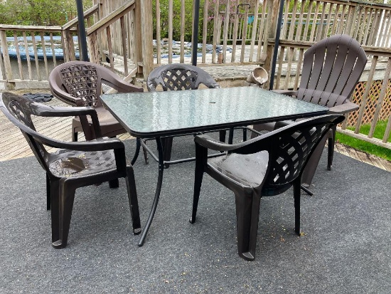 Glass Top Patio Table with Mixed Set of Plastic Chairs