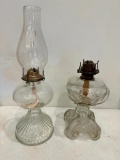Two Clear Glass Oil Lamps, One Does Not Have Chimney