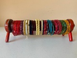 Group of Metal Bracelets with Wooden Holder