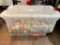 Plastic Container Half Full of Plastic Ornaments