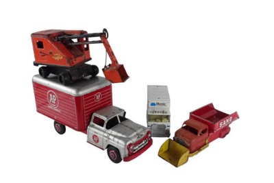 Four Toy Trucks and Equipment
