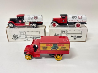 Two Scale Model and One First Gear Toy Trucks