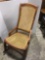 Antique rocking chair with re-caned seat and back